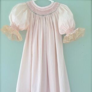 Lovely hand smocked feminine pink dress with ecru antique lace.
